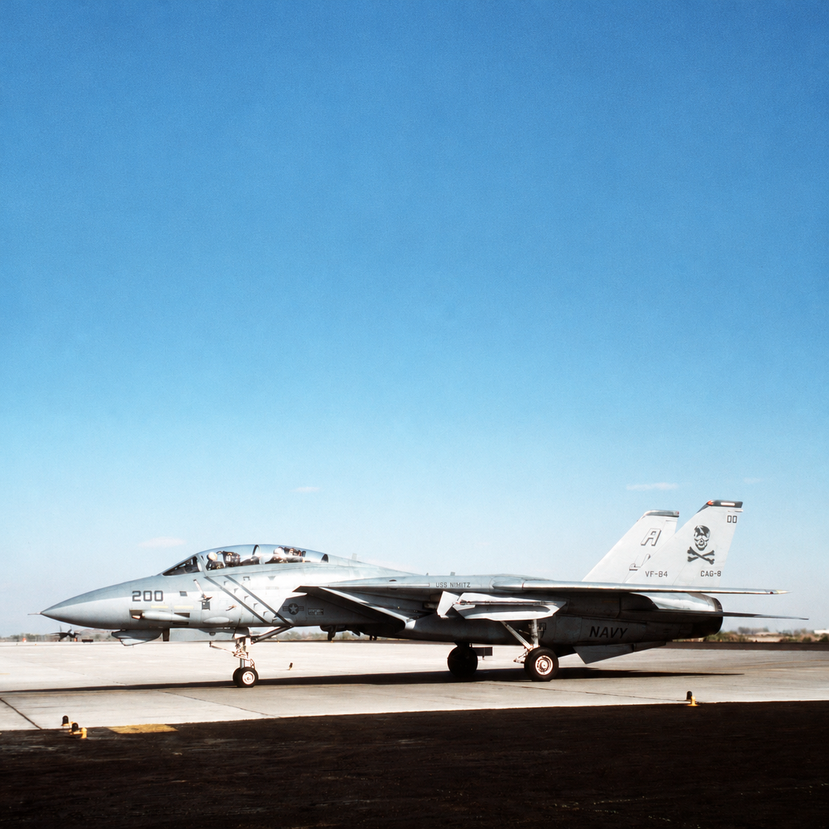 VF-84 Jolly Rogers F-14A Tomcat on the tarmac, with “200” on its nose and skull-and-crossbones markings on its tail.